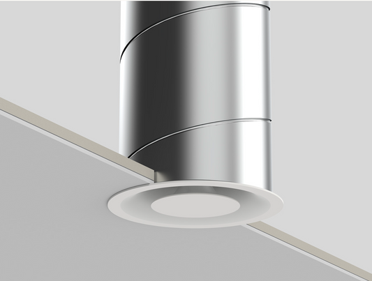 Vue de face de la bouche vmc design pradovent trim installée dans. un plafond